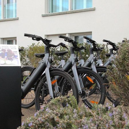 Toscana Charme Resort Tirrenia Esterno foto Electric bicycles for rent at the airport