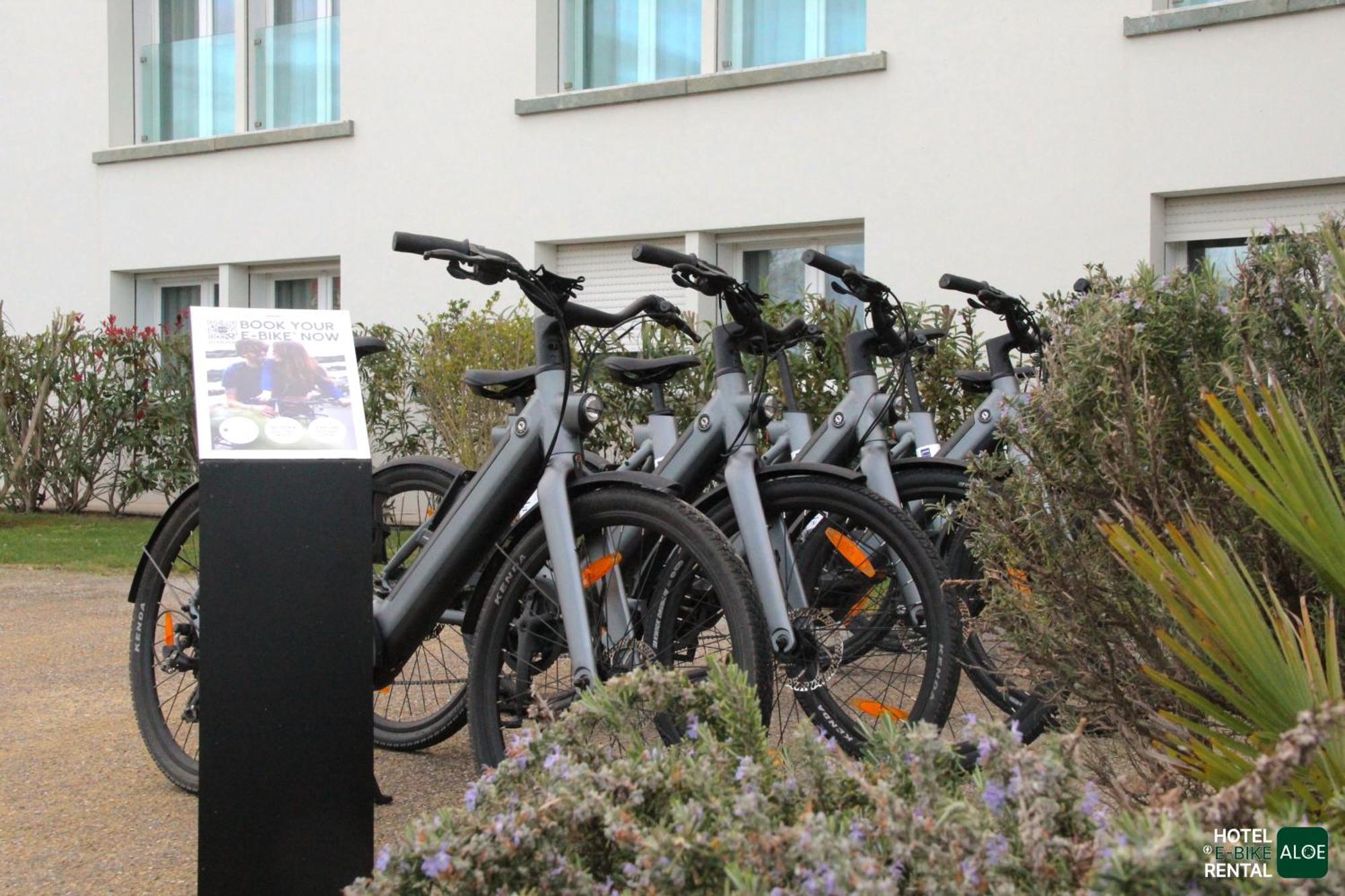 Toscana Charme Resort Tirrenia Esterno foto Electric bicycles for rent at the airport